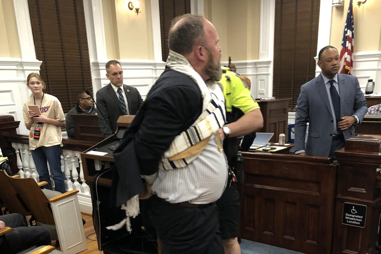 Richard Camden Pace, of Athens, is tased and arrested following a contentious speech at an Athens-Clarke County Commission meeting on April 2, 2024.