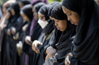 Women line up in prayer during the funeral for the five people killed in a car crash on Lake Street, at the Dar Al-Farooq Islamic Center in Bloomington, Minn., on Monday, June 19, 2023. (Elizabeth Flores/Star Tribune via AP)