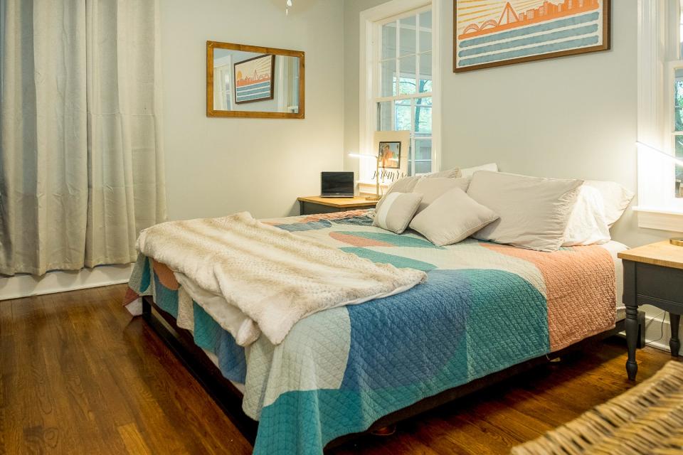 The primary bedroom has a soothing color scheme that is central to relaxation.