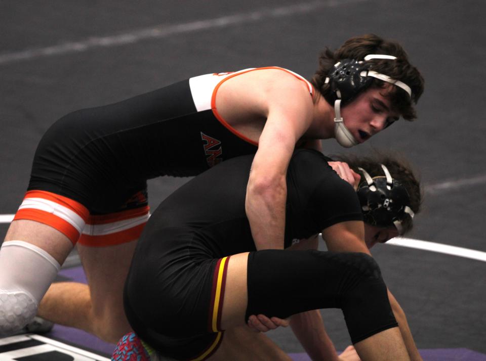 Anderson sophomore Marshall Morency, top, battles Ross senior Jovanni Greco for third place at 138 during the championship finals of the Southwest Ohio Wrestling Coaches Association Coaches Classic wrestling tournament Dec. 23, 2023 at Middletown High School's arena.