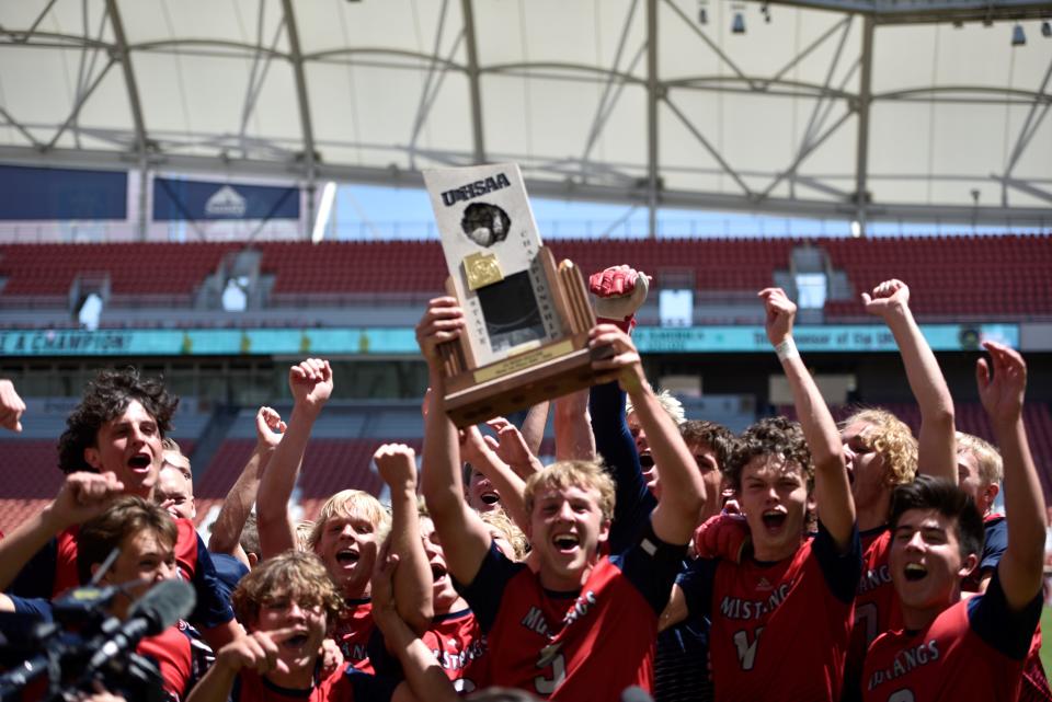 Crimson Cliffs celebrates its first state title in program history over the Ridgeline Riverhawks on May 11, 2022 at Rio Tinto Stadium.