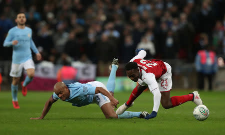 Soccer Football - Carabao Cup Final - Arsenal vs Manchester City - Wembley Stadium, London, Britain - February 25, 2018 Manchester City's Vincent Kompany in action with Arsenal's Danny Welbeck Action Images via Reuters/Peter Cziborra