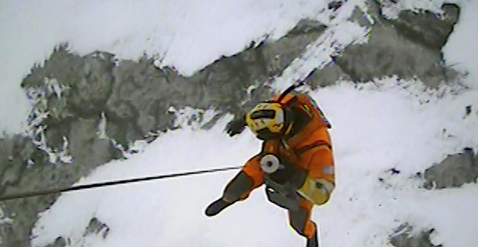 In this image taken from video provided by the U.S. Coast Guard, U.S. Coast Guard Air Station Detroit and Station Marblehead respond to a report of ice fishermen stranded on an ice floe near Catawba Island on Lake Erie, Ohio, Monday, Jan. 22, 2024. Twenty people were rescued from an ice floe in Lake Erie, the Coast Guard said Monday. (U.S. Coast Guard via AP)