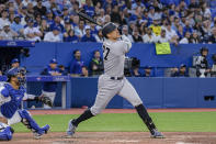 New York Yankees' Giancarlo Stanton watches his home run against the Toronto Blue Jays during the fifth inning of a baseball game Friday, June 17, 2022, in Toronto. (Christopher Katsarov/The Canadian Press via AP)