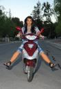 Kim Kardashian rides a motorbike during a photo shoot in Los Angeles.