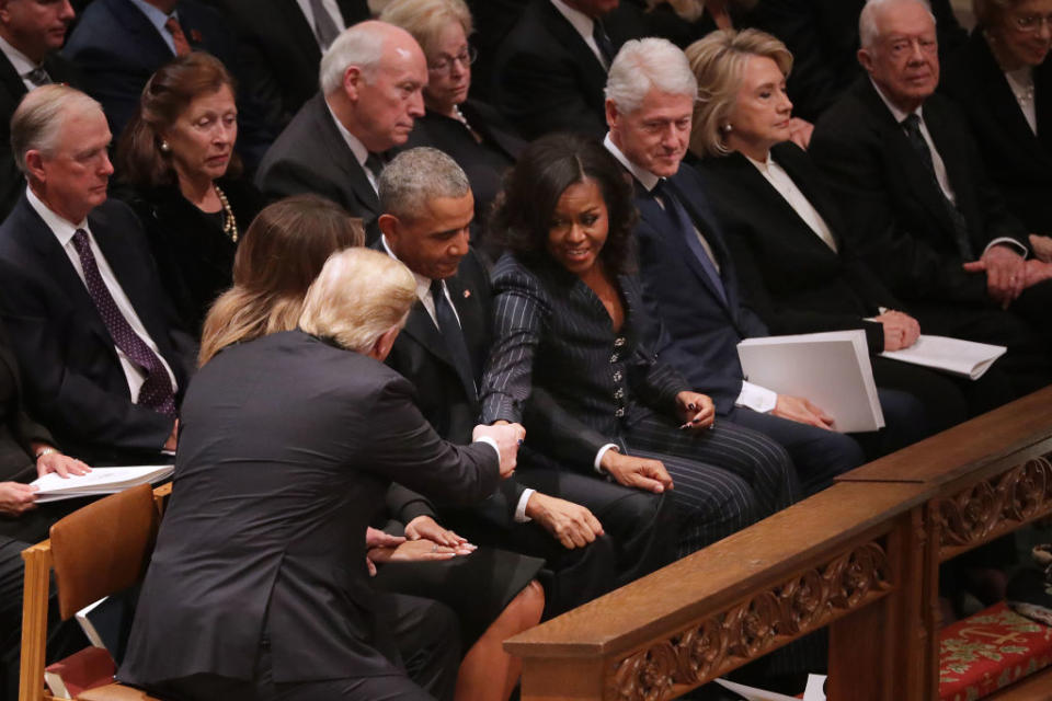 President Donald Trump and first lady Melania Trump greet former President Barack Obama and Michelle Obama as they join other former presidents and vice presidents and their spouses for the state funeral for former President George H.W. Bush at the National Cathedral on Dec. 5, 2018 in Washington, D.C.