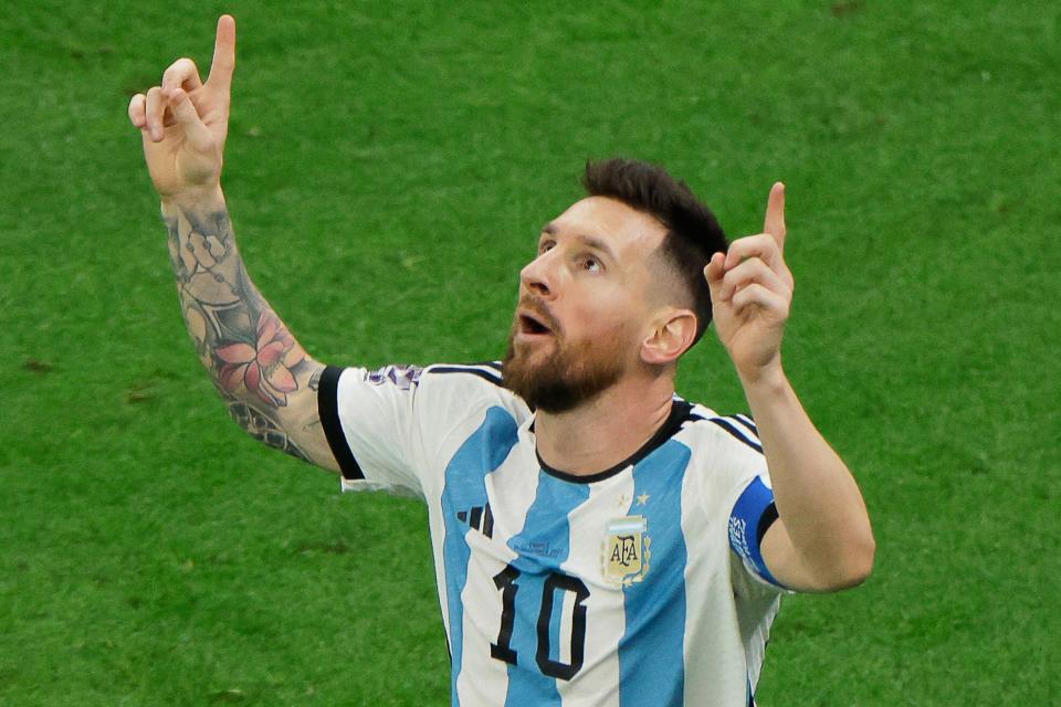 TOPSHOT - Argentina's forward #10 Lionel Messi celebrates scoring his team's first goal from the penalty spot during the Qatar 2022 World Cup football final match between Argentina and France at Lusail Stadium in Lusail, north of Doha on December 18, 2022. (Photo by Odd ANDERSEN / AFP) (Photo by ODD ANDERSEN/AFP via Getty Images)