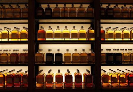 Bottles of Suntory Holdings single cask whisky are displayed at its Yamazaki Distillery in Shimamoto town, Osaka prefecture December 15, 2013. REUTERS/Sophie Knight