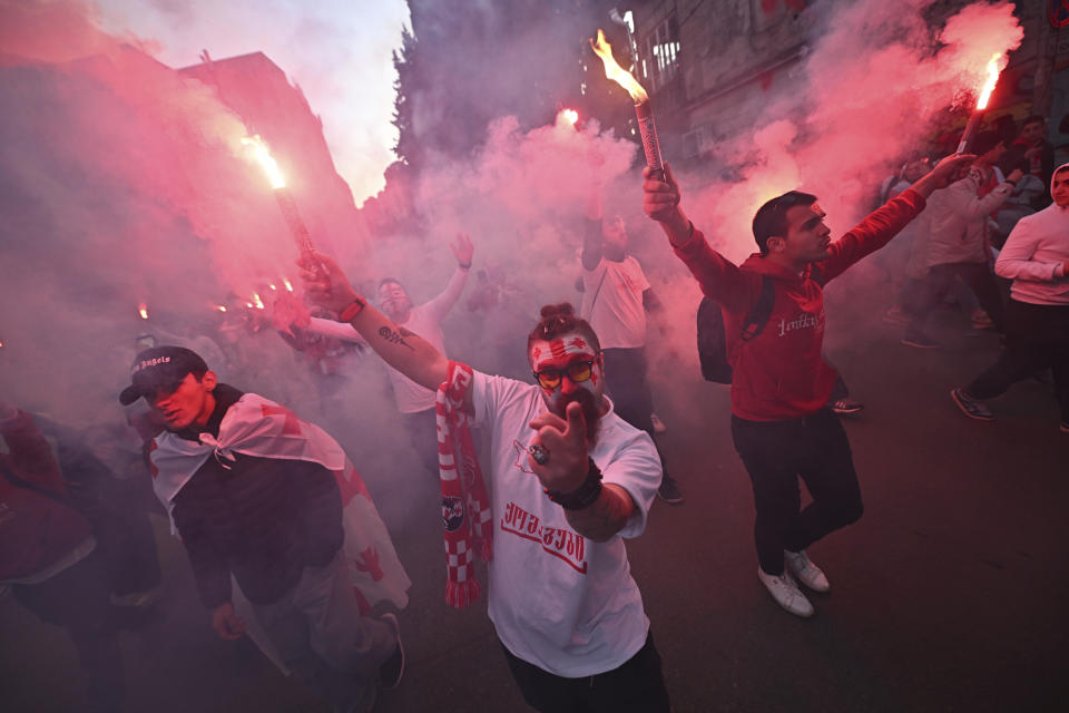 Georgia's fans walk to the stadium prior to the Euro 2024 qualifying play-off soccer match between Georgia and Greece at the Boris Paichadze National Stadium in Tbilisi, Georgia, Tuesday, March 26, 2024. (AP Photo/Tamuna Kulumbegashvili)