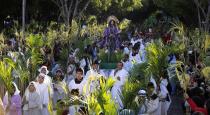 Catholics carry a statue of Jesus Christ on a donkey during a Palm Sunday procession outside the Metropolitan Cathedral in Caacupe April 13, 2014. Palm Sunday commemorates Jesus Christ's triumphant entry into Jerusalem on the back of a donkey and marks the start of Holy Week. REUTERS/Jorge Adorno (PARAGUAY - Tags: RELIGION)