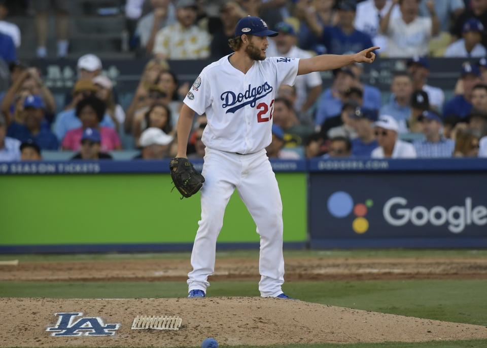 Los Angeles Dodgers's Clayton Kershaw gestures after an out during the seventh inning of Game 5 of the National League Championship Series baseball game against the Milwaukee Brewers Wednesday, Oct. 17, 2018, in Los Angeles. (AP Photo/Mark J. Terrill)