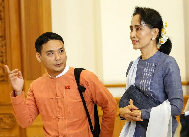 FILE PHOTO: National League for Democracy party (NLD) leader Aung San Suu Kyi and Member of Parliament Thaw leave after attending a lower house of parliament meeting at Naypyitaw