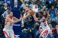 Nov 12, 2017; Indianapolis, IN, USA; Indiana Pacers center Domantas Sabonis (11) passes the ball while Houston Rockets forward Ryan Anderson (33) and center Clint Capela (15) defend in the first half of the game at Bankers Life Fieldhouse. Trevor Ruszkowski-USA TODAY Sports