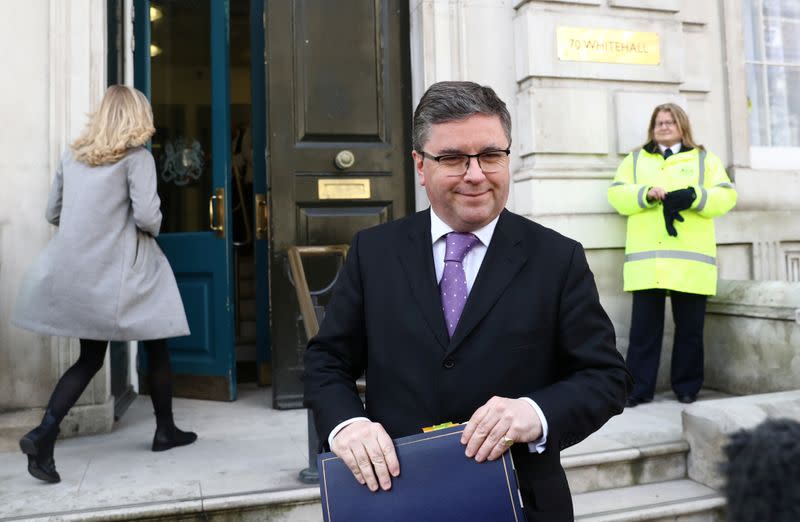 Britain's Justice Secretary Robert Buckland leaves after attending a meeting to address the government's response to the coronavirus outbreak, at Cabinet Office in London