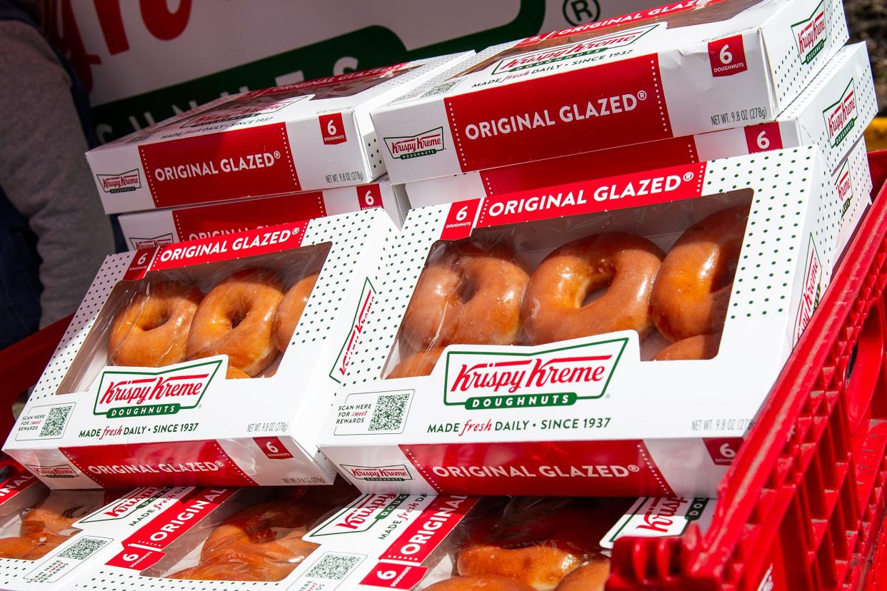 Doughnuts sit out to be given to people during a Krispy Kreme groundbreaking on Tuesday, March 26, 2024, in Fort Collins, Colo.