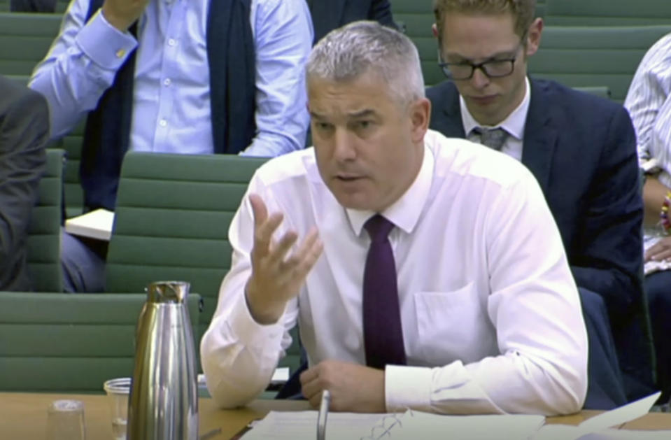 Britain's Brexit secretary Stephen Barclay gives evidence to the Exiting the European Union Committee of lawmakers at parliament in London Wednesday Oct. 16, 2019. Barclay appeared before the government committee Wednesday to update lawmakers on progress of negotiations for Britain's EU withdrawal. (House of Commons via AP)