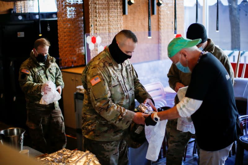 Military personnel receives food donated by World Central Kitchen ahead of U.S. President-elect Joe Biden's inauguration, in Washington