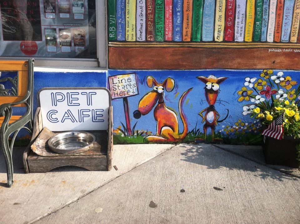 This July 20, 2013 photo provided by Browseabout Books shows a water dish outside the shop’s colorfully painted storefront in Rehoboth Beach, Del. Browseabout Books is one of a number of businesses around Rehoboth Beach that aim to make customers with dogs feel welcome. Although pets are not allowed inside the store, in addition to the water bowl for thirsty pets, there is a window where patrons accompanied by their dogs can get something to drink without going inside, and dogs can get treats at the window, too. (AP Photo/Browseabout Books, Alex Colevas)