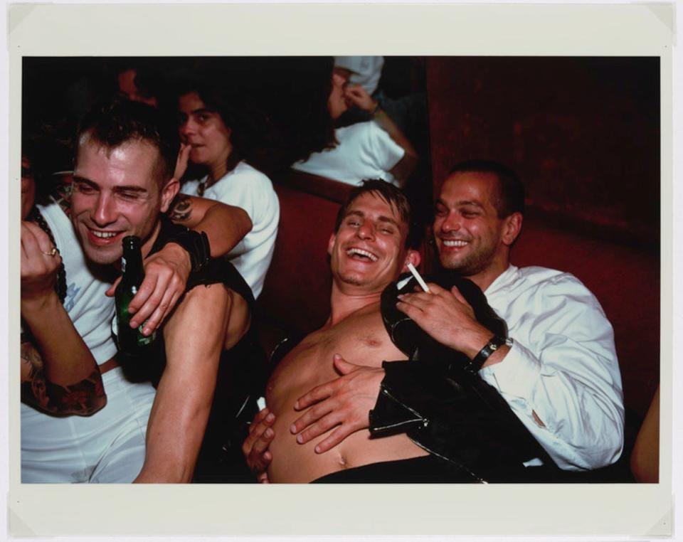 ‘Clemens, Jens and Nicolas Laughing at Le Pulp, Paris’ by Nan Goldin, 1999 (V&A/Nan Goldin)