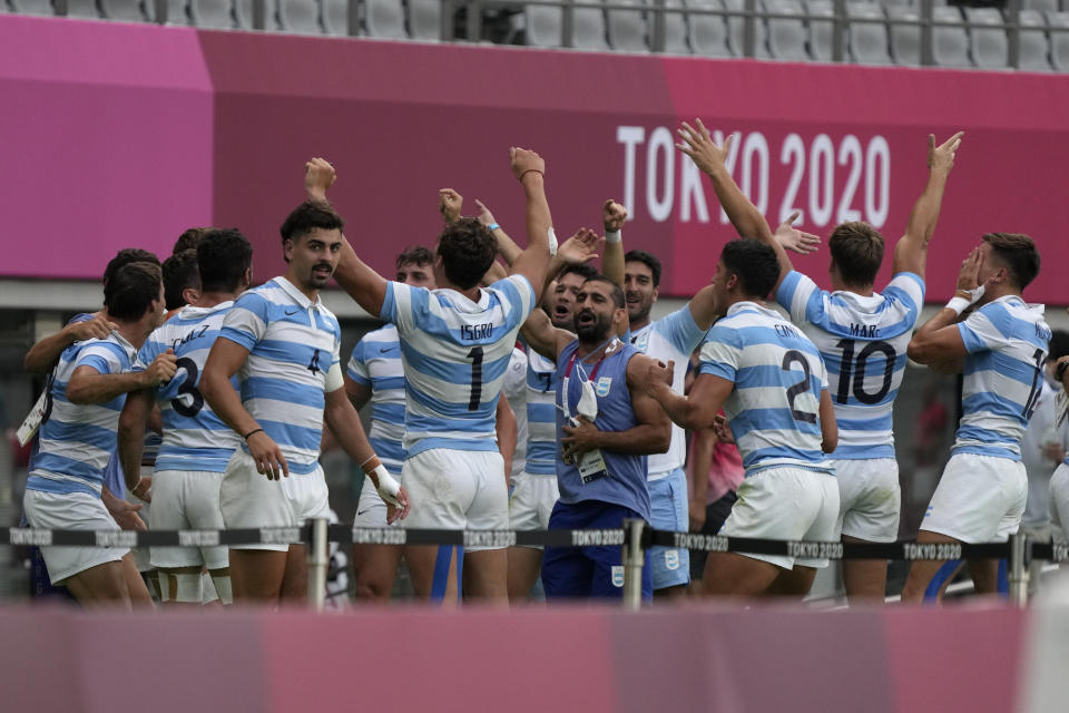 Argentina players celebrate their win over Britain in their men's rugby sevens bronze medal match at the 2020 Summer Olympics, Wednesday, July 28, 2021 in Tokyo, Japan. (AP Photo/Shuji Kajiyama)