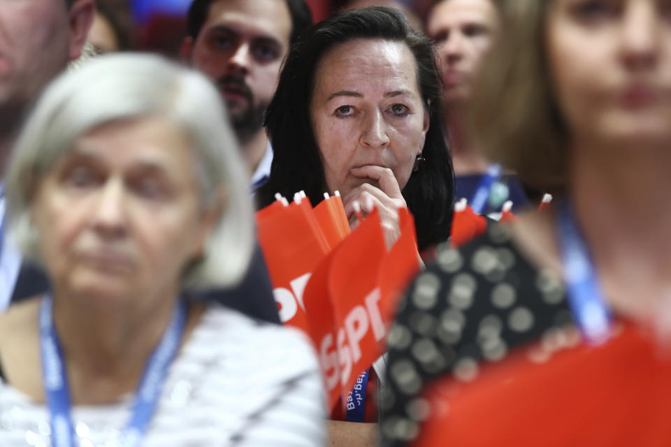 Supporters of the Social Democratic Party SPD react after the first exit polls for the Bavarian state election in Munich, southern Germany, Sunday, Oct. 14, 2018. (Daniel Karmann/dpa via AP)