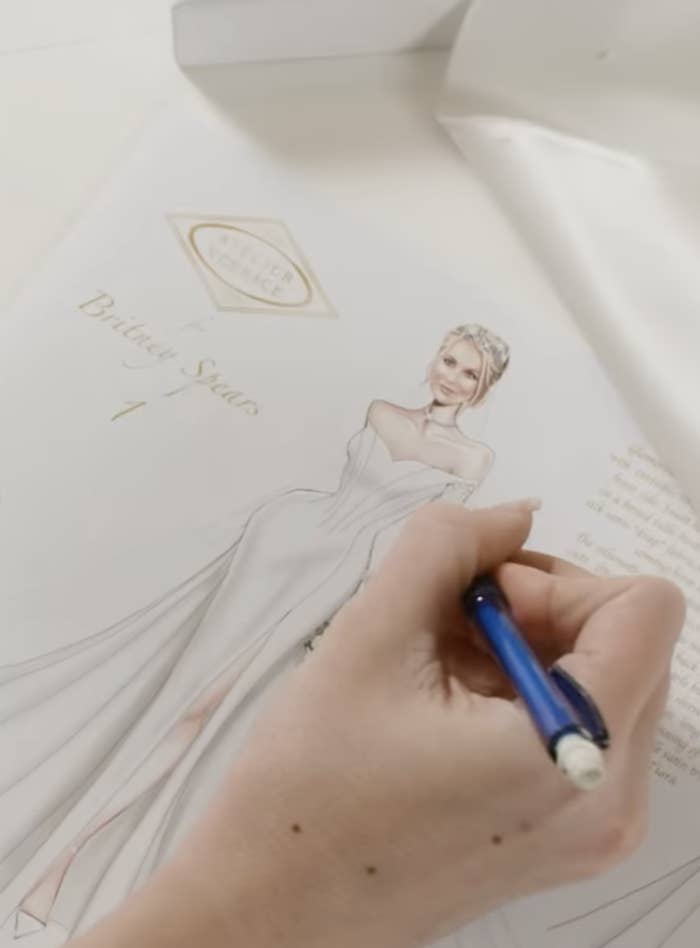 Hand drawing an illustration of Britney in her wedding gown