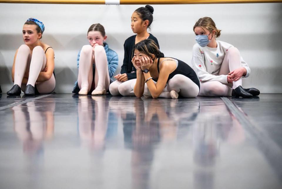 “Canon guard” dancer Nita, center, 11, sits with other young dancers as they rehearse for Sacramento Ballet’s “Nutcracker” at their midtown Sacramento studios Tuesday, Nov. 29, 2022, in preparation for performances from Dec. 10 to 24.