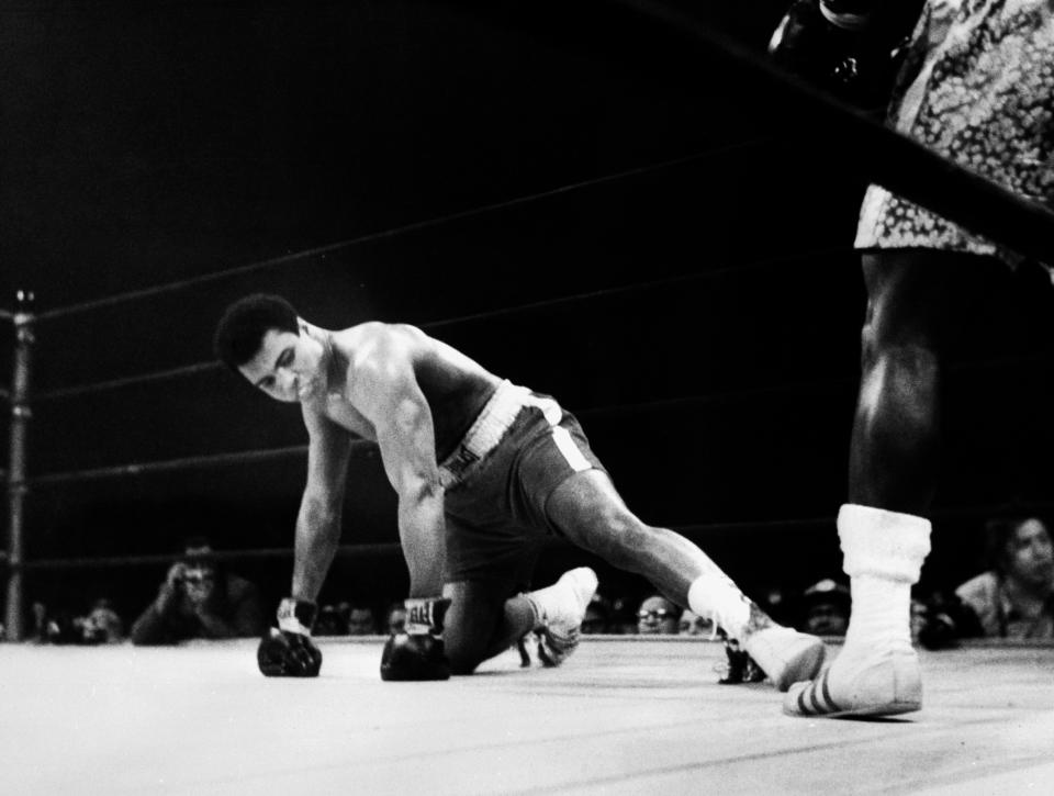 <p>A picture taken March 08 1971 in New York at the Madison Square Garden of the heavyweight boxing world championship fight between Muhammad Ali (Cassius Clay) (on the floor) and Joe Fazier at the end of which Frazier kept his title of heavyweight boxing world champion. (AFP/Getty Images)</p> 