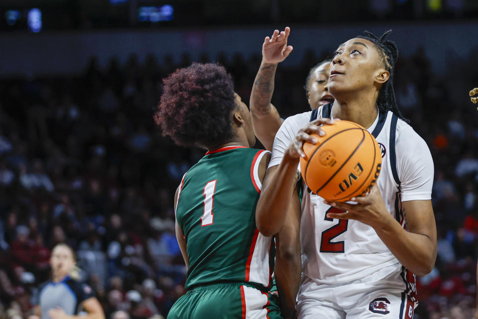 South Carolina forward Ashlyn Watkins (2) drives to the basket past Mississippi Valley State guard Sh'Diamond McKnight during the first half of an NCAA college basketball game in Columbia, S.C., Friday, Nov. 24, 2023. (AP Photo/Nell Redmond)