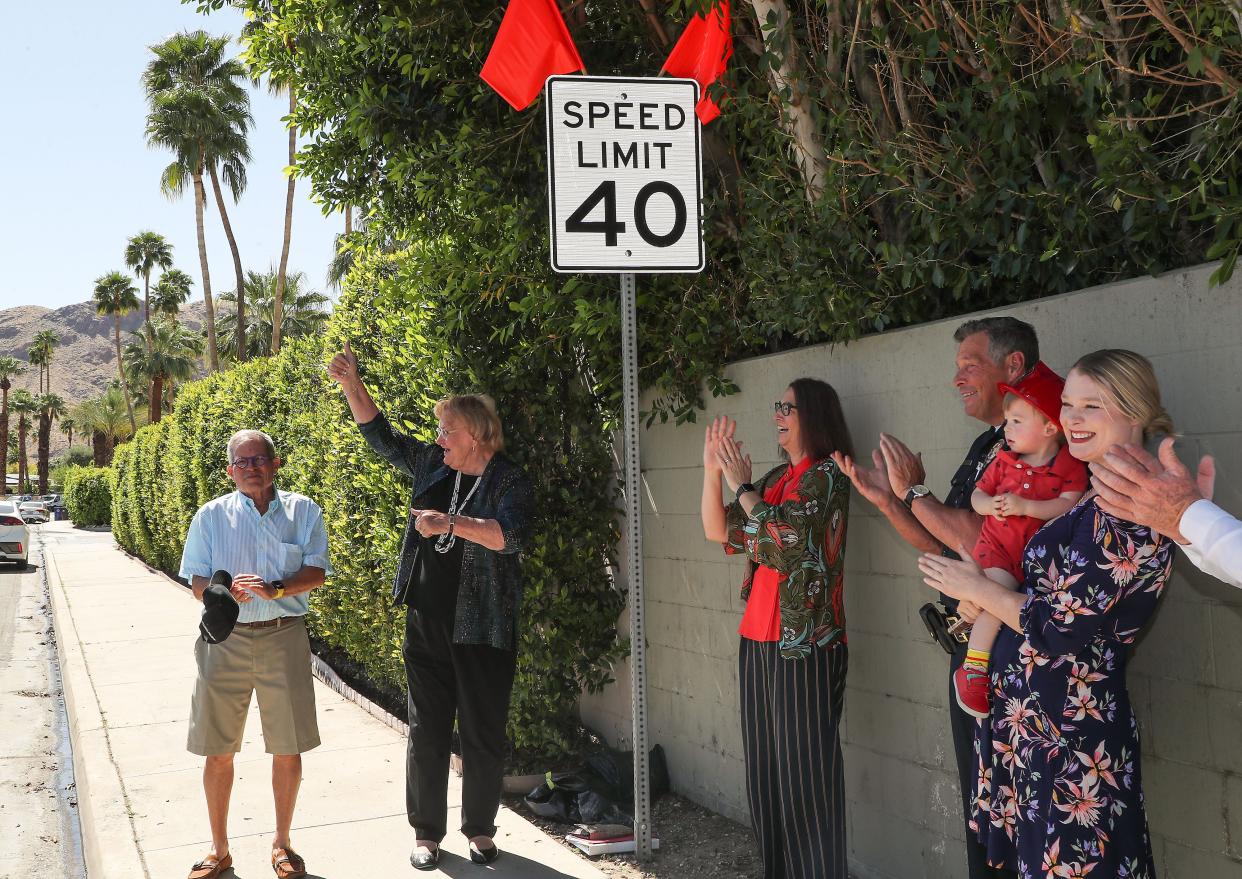 From left, Peter Sipkins, Lisa Middleton, Laura Friedman, Andy Mills and Christy Holstege unveil a new lower speed limit sign along Toledo Ave in Palm Springs, Calif., April 8, 2022.