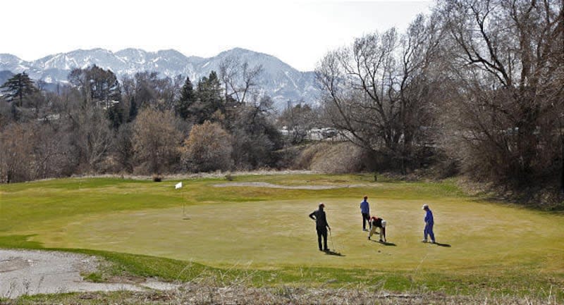 Golfers get into the swing of spring golfing at Bonneville Golf Course in Salt Lake City.