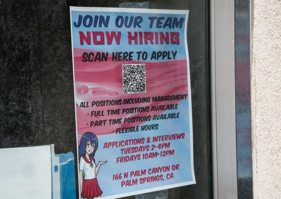 An advertisement for help is attached to the window at Dragon Lili Boba Bar in downtown Palm Springs, seen Jan. 17.