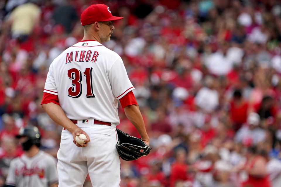 Cincinnati Reds starting pitcher Mike Minor (31) gets set to deliver during the second inning of a baseball game against the Atlanta Braves, Friday, July 1, 2022, at Great American Ball Park in Cincinnati.