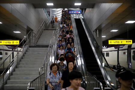 People arrive to take part in an anti-terror drill as a part of the Ulchi Freedom Guardian exercise in Seoul, South Korea, August 23, 2017. REUTERS/Kim Hong-Ji