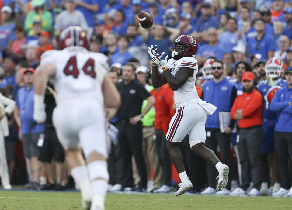 South Carolina wide receiver Dakereon Joyner, right, catches a touchdown pass on a fake punt during the first half of an NCAA college football game against Florida, Saturday, Nov. 12, 2022, in Gainesville, Fla. (AP Photo/Matt Stamey)