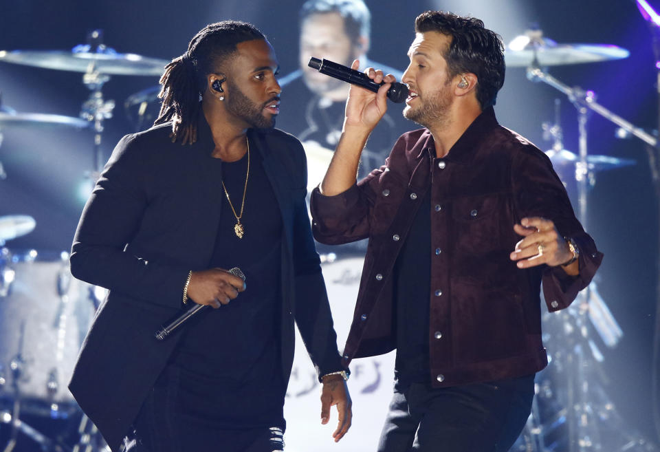 <p>Jason Derulo, left, and Luke Bryan perform at the CMT Music Awards at Music City Center on Wednesday, June 7, 2017, in Nashville, Tenn. (Photo by Wade Payne/Invision/AP) </p>