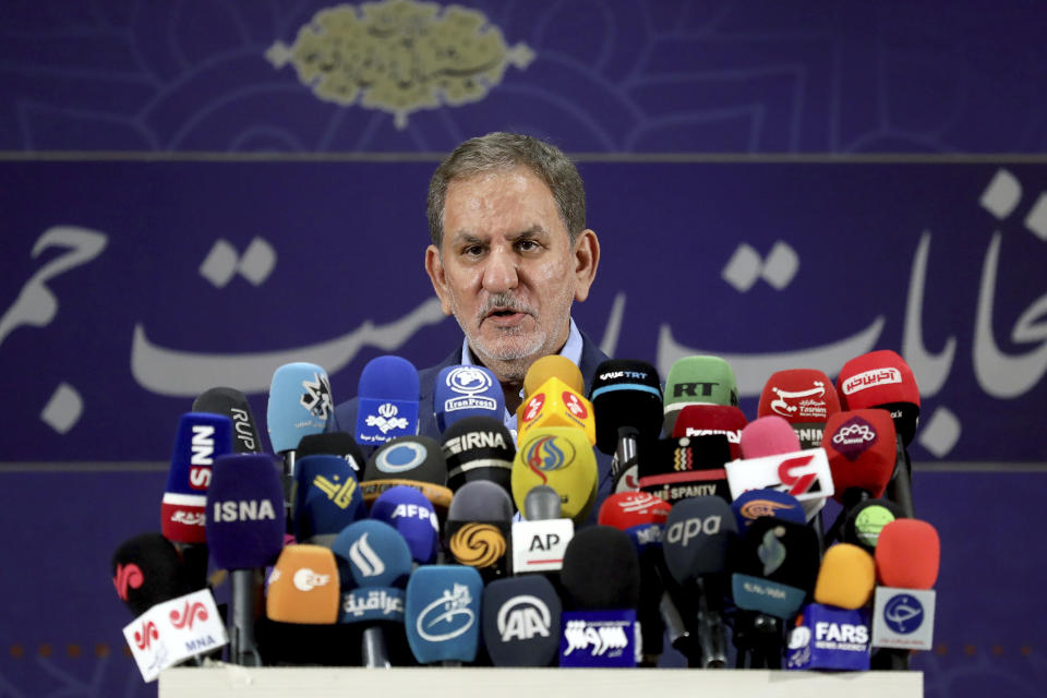 Iranian Vice-President Eshaq Jahangiri speaks to media after registering his name as a candidate for the June 18 presidential elections at the elections headquarters of the Interior Ministry in Tehran, Iran, Saturday, May 15, 2021. (AP Photo/Ebrahim Noroozi)