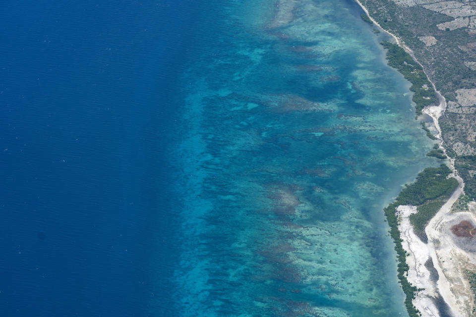 The Haitian coastline is seen from a VM-22 Osprey, on a relief mission en route to Toussaint Louverture International Airport, Saturday, Aug. 28, 2021, in Port-au-Prince, Haiti. The VMM-266, "Fighting Griffins," from Marine Corps Air Station New River, from Jacksonville, N.C., are flying in support of Joint Task Force Haiti after a 7.2 magnitude earthquake on Aug. 22, caused heavy damage to the country. (AP Photo/Alex Brandon)