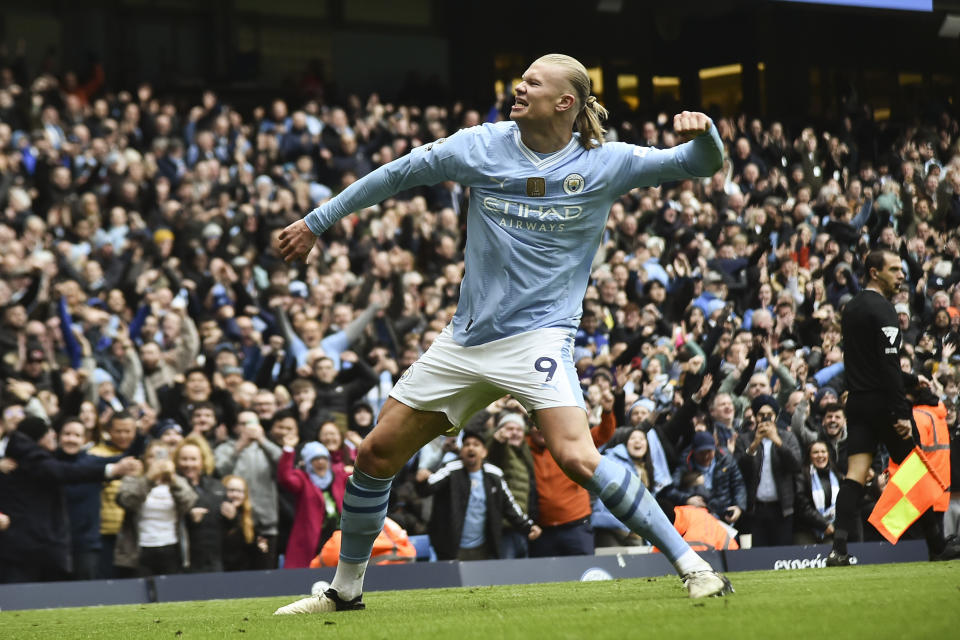 Manchester City's Erling Haaland celebrates with after scoring his side's second goal during the English Premier League soccer match between Manchester City and and Everton, at the Etihad stadium in Manchester, England, Saturday, February 10, 2024. (AP Photo/Rui Viera)