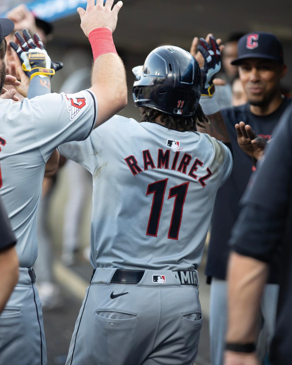 Cleveland Guardians third baseman Jose Ramirez high fives teammates in the dugout after a home run in the third inning against the Detroit Tigers at Comerica Park on Monday, July 29, 2024 in Detroit.