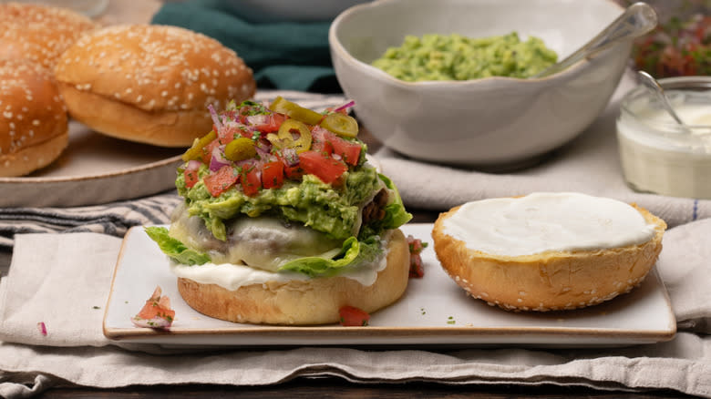 assembling a nacho burger