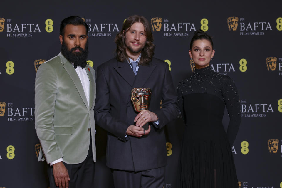 Himesh Patel, from left, Ludwig Goransson, winner of the original score award for 'Oppenheimer', and Marisa Abela, pose for photographers at the 77th British Academy Film Awards, BAFTA's, in London, Sunday, Feb. 18, 2024. (Photo by Vianney Le Caer/Invision/AP)