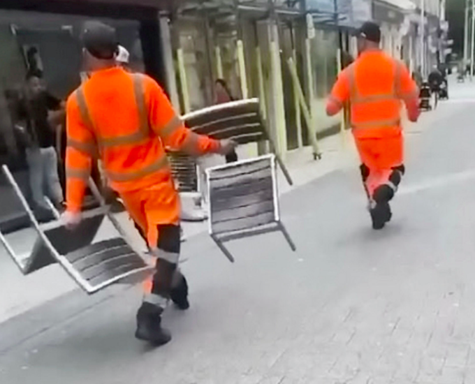 A witness said the binmen were throwing  outdoor chairs at random people as the incident escalated. (SWNS)