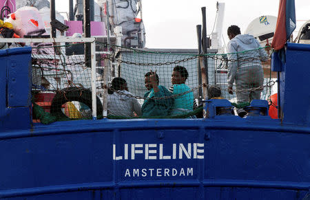 Migrants are seen on the deck of the Mission Lifeline rescue boat in the central Mediterranean Sea, June 21, 2018. Picture taken June 21, 2018. Hermine Poschmann/Misson-Lifeline/Handout via REUTERS