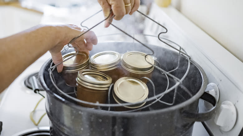 Person canning oranges