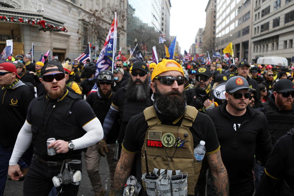 Trump supporters and members of the Proud Boys attend a rally.