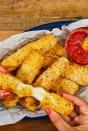 <p>Mozzarella sticks are the quintessential party appetiser. They're hot, crunchy, and oozing with molten cheese—what's not to love?! Dipped in <a href="https://www.delish.com/uk/cooking/recipes/a30311380/marinara-sauce-recipe/" rel="nofollow noopener" target="_blank" data-ylk="slk:homemade marinara sauce;elm:context_link;itc:0;sec:content-canvas" class="link ">homemade marinara sauce</a>, we think there's no better snack. </p><p>Get the <a href="https://www.delish.com/uk/cooking/recipes/a31465728/mozzarella-sticks-recipe/" rel="nofollow noopener" target="_blank" data-ylk="slk:Air Fryer Mozzarella Sticks;elm:context_link;itc:0;sec:content-canvas" class="link ">Air Fryer Mozzarella Sticks</a> recipe.</p>