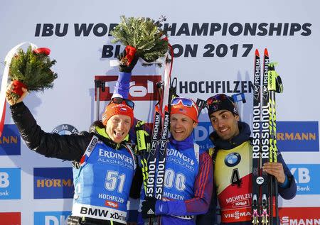 Biathlon - IBU World Championships - Men's 15km Individual - Hochfilzen, Austria - 16/2/17 - Ondrej Moravec of Czech Republic, Lowell Bailey from the U.S. and Martin Fourcade of France react. REUTERS/Leonhard Foeger