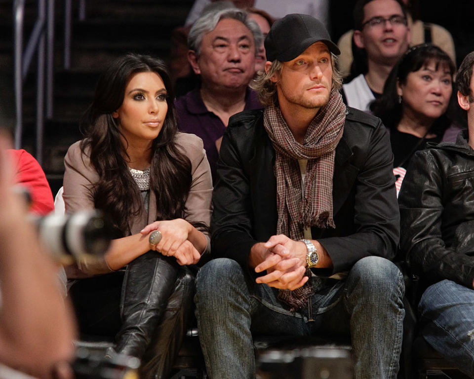 Kim and Gabriel Aubry watching a game from the stands