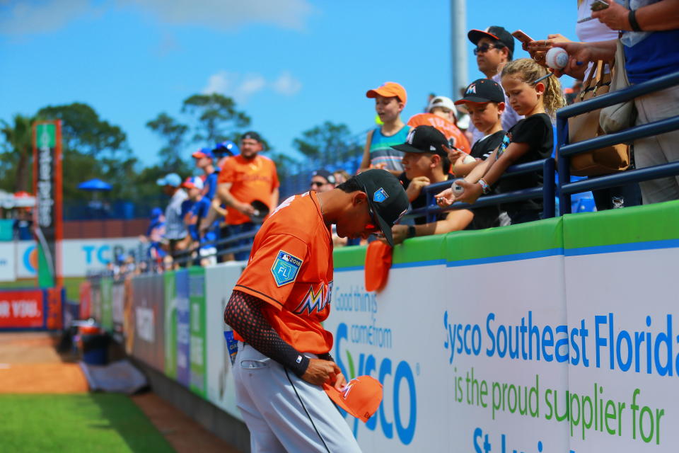 <p>Miami Marlins player Yadiel Rivera signs for fans before the baseball game against the New York Mets at First Data Field in Port St. Lucie, Fla., Feb. 25, 2018. (Photo: Gordon Donovan/Yahoo News) </p>